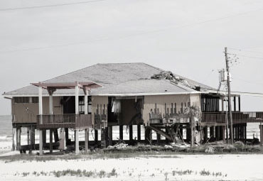 Wind damage - spray foam can help prevent uplift to Baton Rouge roofs